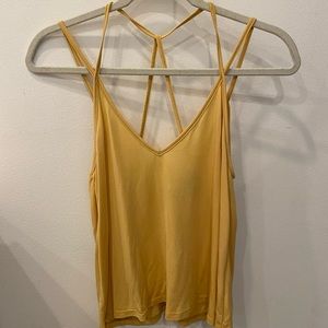 Cute yellow tank top with strap detail. Great for summer